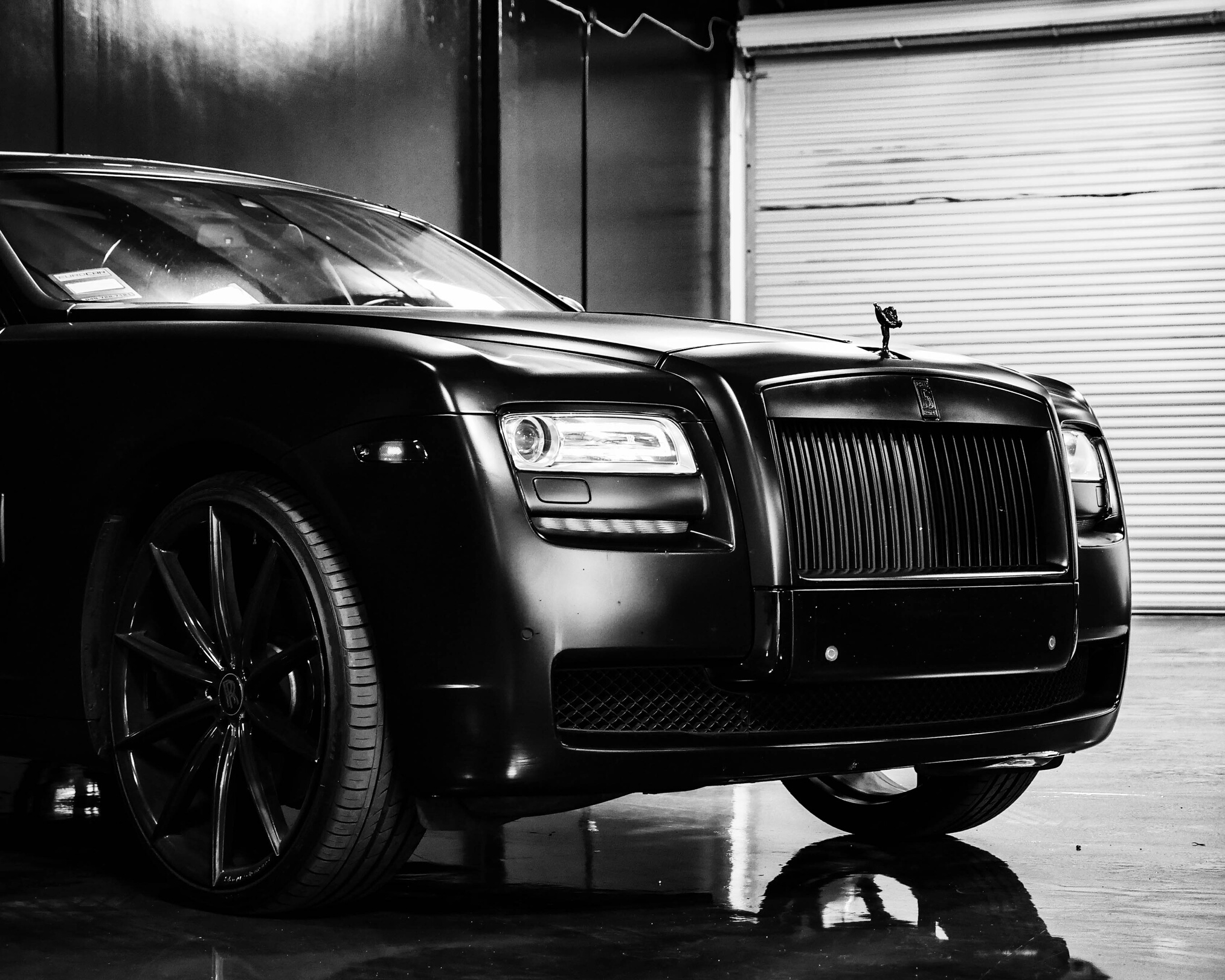 Details of expensive black car in garage